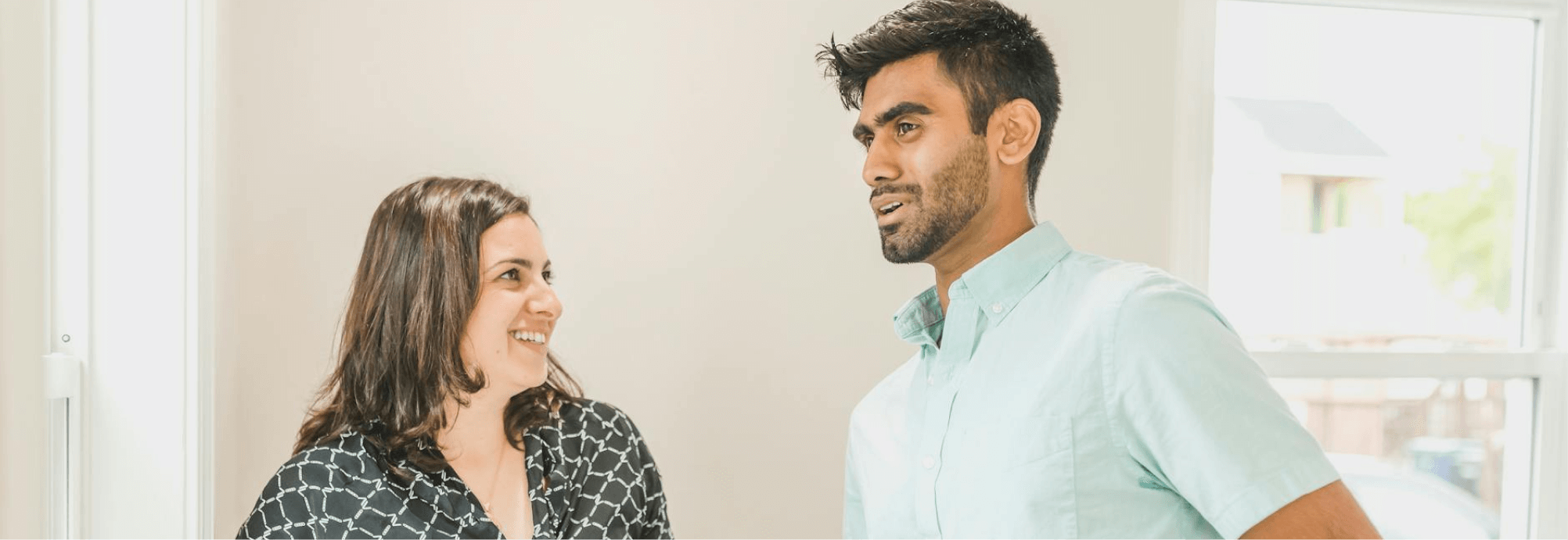 A couple talking through a home purchase